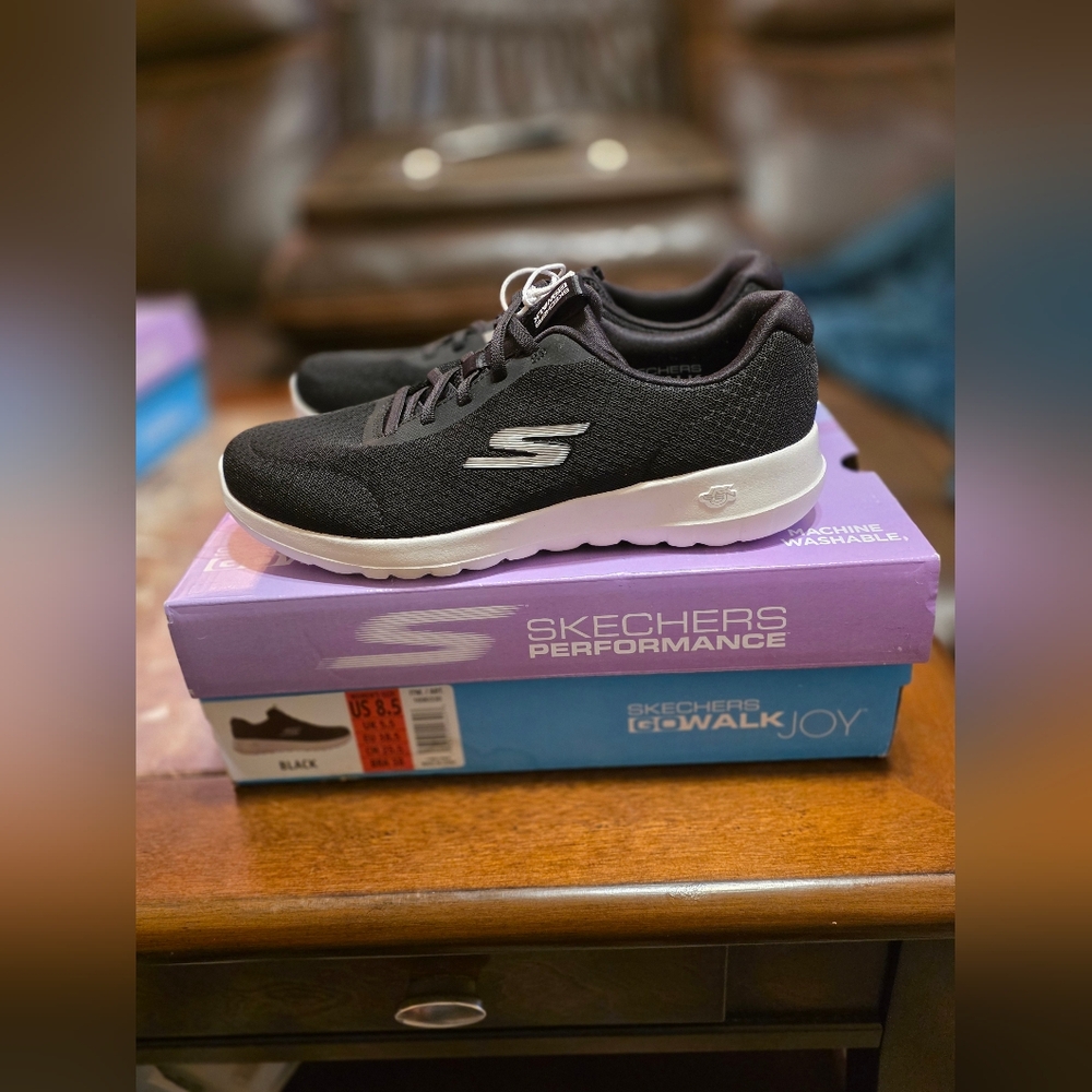 Skechers Gowalk Joy Black Sneakers with 5GEN cushioned midsoles.